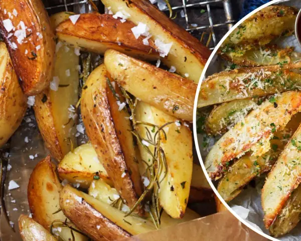 Krispiga klyftpotatis i ugn, strösslade med flingsalt och rosmarin. En del är toppade med parmesan och persilja, redo att doppas i ketchup eller dipp.